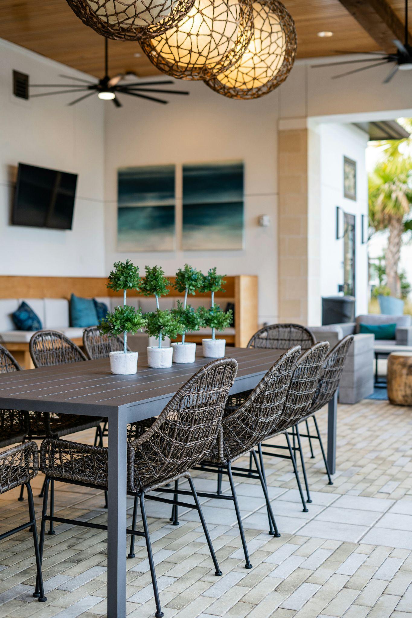 A stylish outdoor dining area with aluminum patio cover installation in Prather.