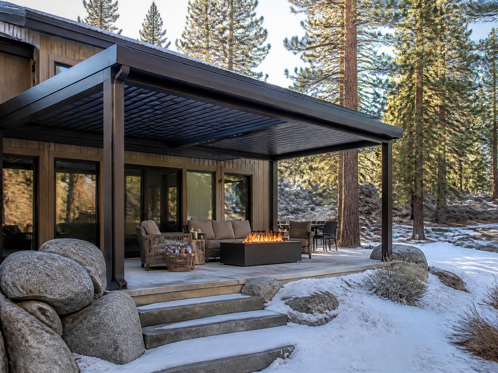 Custom louvered aluminum patio cover installed on a home in Shaver Lake, CA