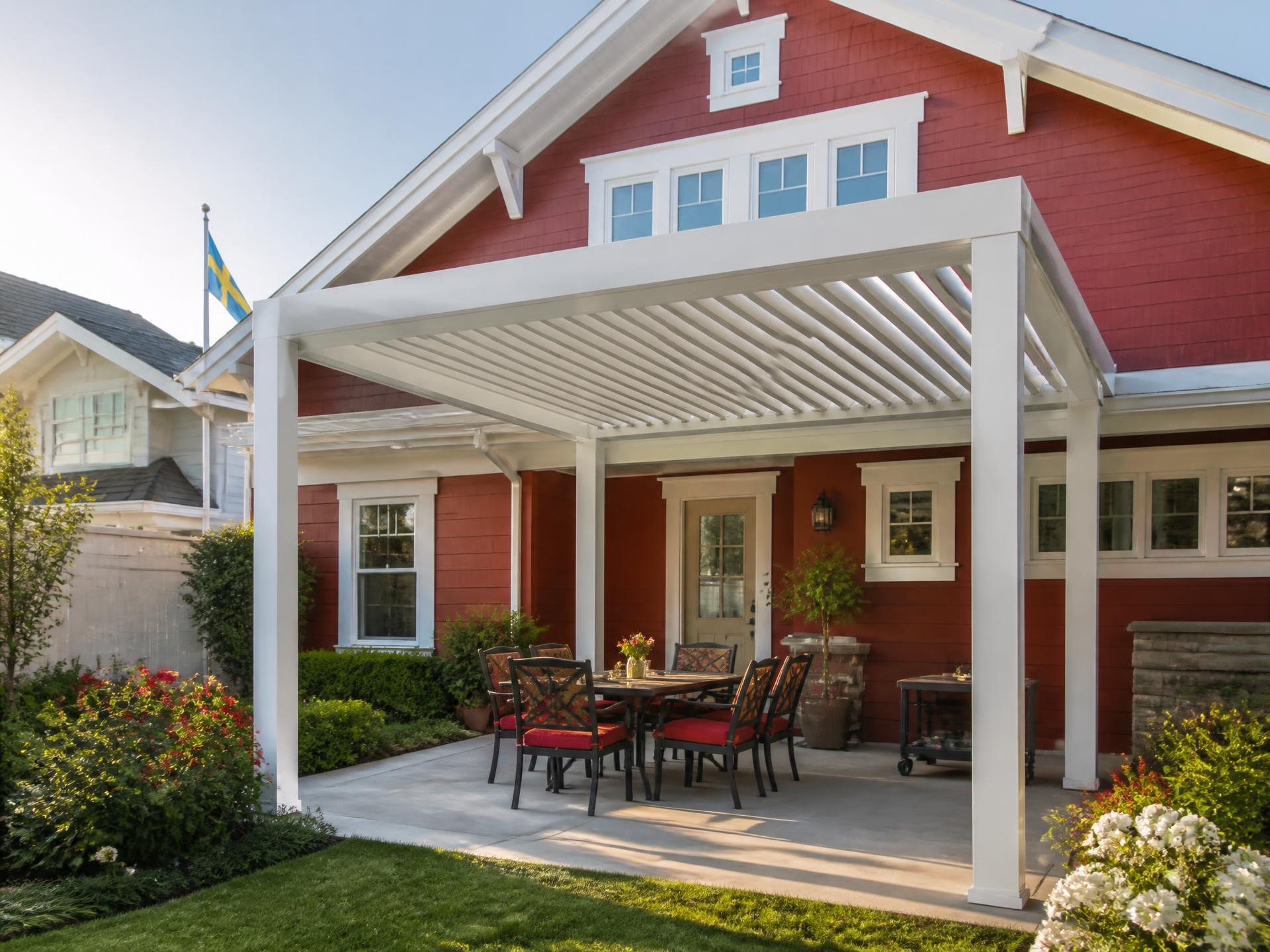 Custom louvered aluminum patio cover installed on a home in Kingsburg, CA