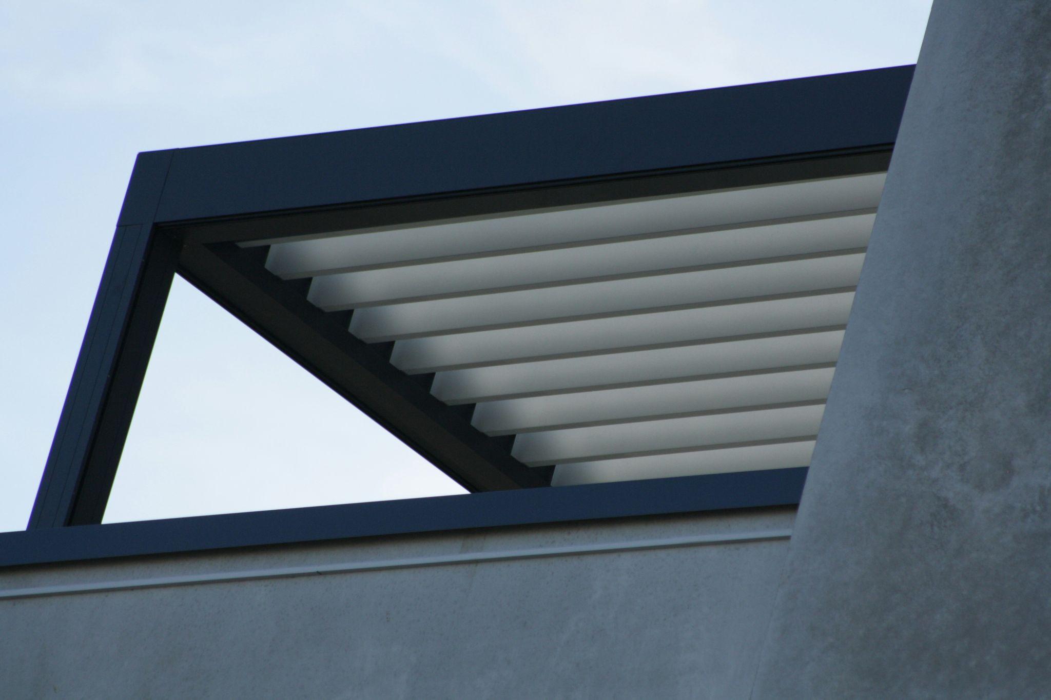 A sleek outdoor structure features motorized louvered patio covers in Shaver Lake.
