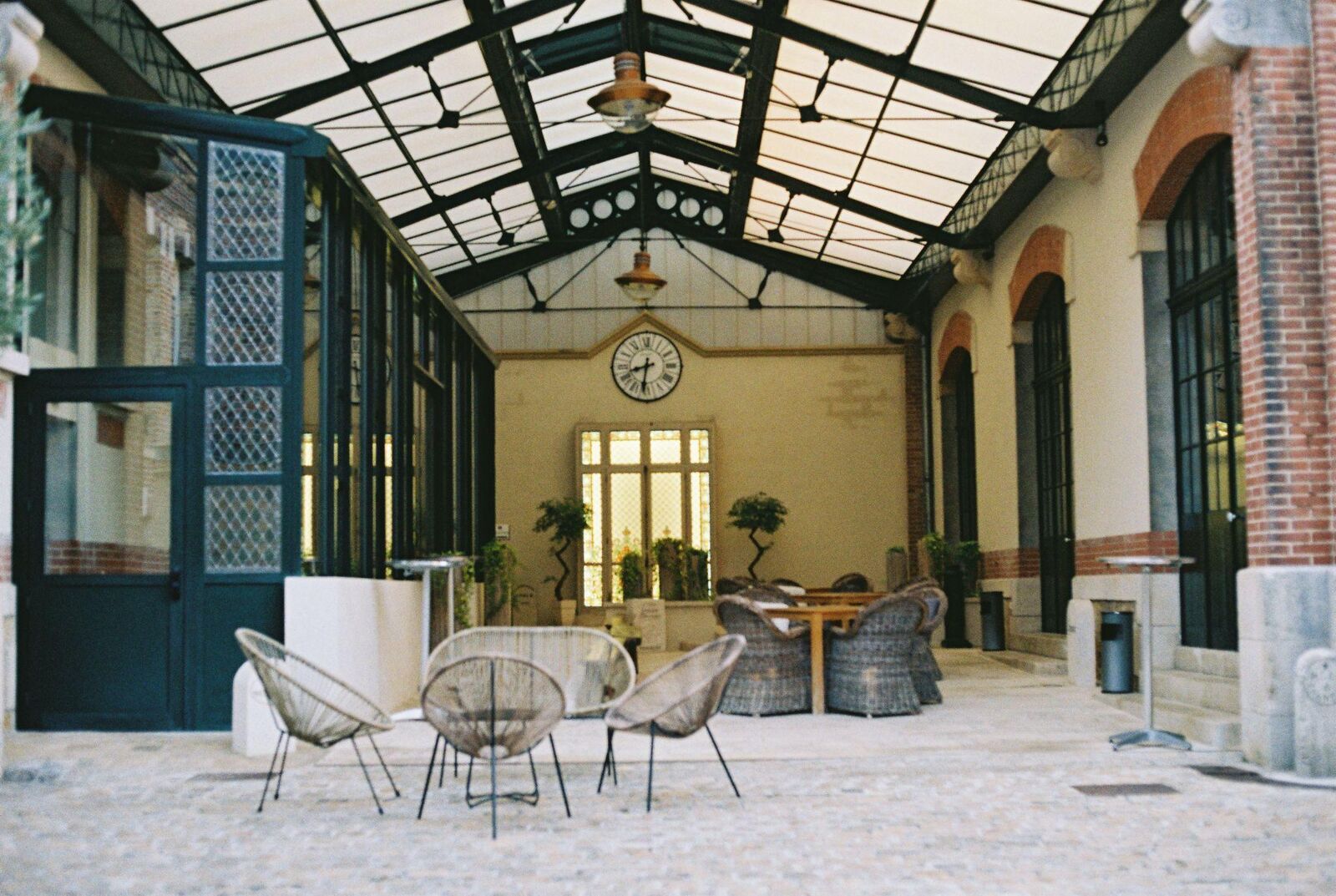 An outdoor dining area beneath a shaded patio roof showcases the comfort of aluminum patio covers in Kingsburg.