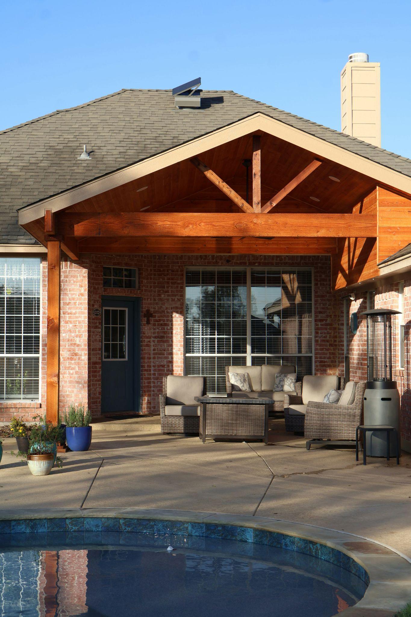 A spacious backyard patio features a sturdy roof structure suited to aluminum patio covers in Tollhouse.